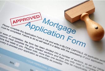 Approved Mortgage loan application with rubber stamp